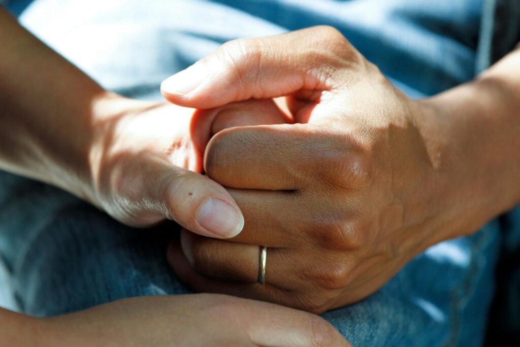 couple's hands helping each to deal with anxiety