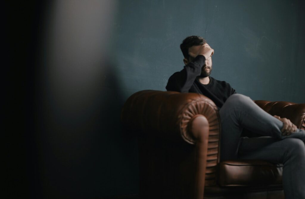 Man with anxiety in dark room